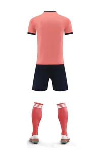 Full back view of peach pink soccer uniform set including jersey shorts and striped socks