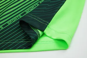 Macro view of soccer jersey hem with green and black striped fabric texture