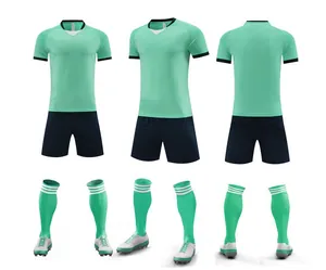 Comprehensive view of the mint green and navy soccer uniform set for training matches