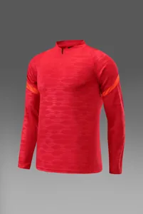Haut de football rouge à manches longues avec quart de zip et texture ondulée