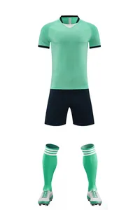 Full soccer kit set with mint green jersey navy shorts and matching socks