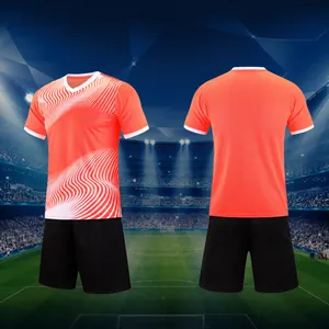 Professional orange football jersey set with white wave patterns and matching black shorts