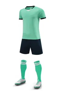 Professional football training set featuring a mint green jersey and navy blue shorts