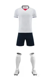 Full white and navy football kit set including jersey, shorts, socks, and soccer cleats.