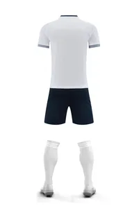 Back view of a professional white soccer jersey with navy shorts and soccer socks