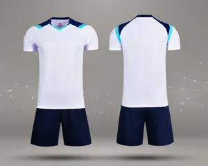 Detailed front and back views of white and navy blue dry-fit soccer training kit