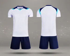 Detailed front and back views of white and navy blue dry-fit soccer training kit