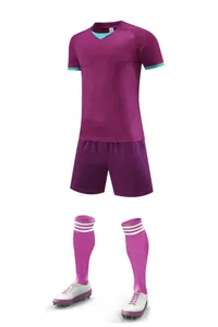 Complete purple soccer kit set including jersey, shorts, socks, and cleats on white background