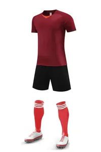 Full maroon soccer uniform set including jersey, black shorts, red socks, and cleats.