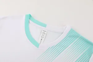 Close-up of V-neck soccer training jersey showing breathable mesh fabric and inner size label.