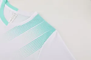 Close-up of white and mint green sports jersey collar with breathable mesh texture