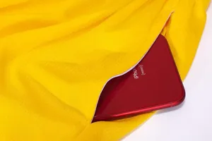 Detailed view of yellow basketball shorts pocket showing ample storage capacity