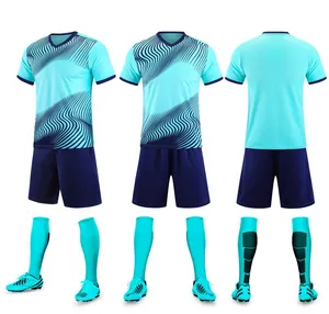 Detailed view of the cyan soccer uniform set featuring a unique navy blue wave pattern