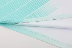 Detailed view of quick-dry football jersey hem with professional stitching and mesh fabric