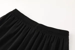 Close-up detail of the elastic waistband on breathable black soccer training shorts for men