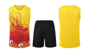 Detailed view of men's yellow dragon pattern basketball jersey and shorts set for sports