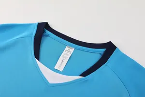 Close-up detail of the breathable neckline on a blue soccer jersey with fabric labels