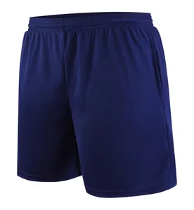 Detail of navy blue breathable mesh soccer training shorts with elastic waistband.