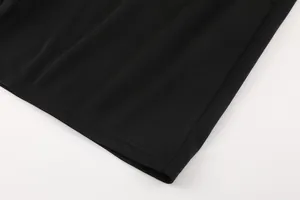 Close-up of black breathable quick-dry football jersey hem with fine stitching