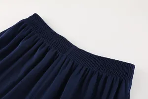 Detailed close-up view of the high-elastic waistband on navy blue football shorts