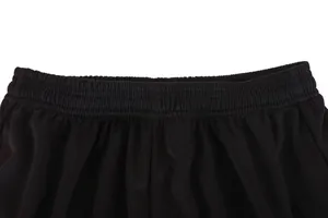 Detail shot of the elastic waistband of black football shorts for sports training