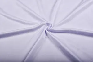 Close-up of white quick-dry soccer jersey fabric with subtle geometric jacquard pattern