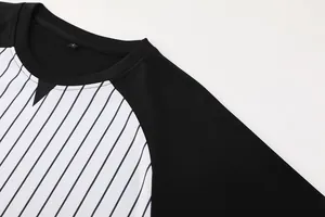 Close-up detail of a professional striped basketball referee shirt collar and fabric.