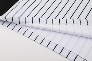 Close-up view showing the stitching detail of a pinstriped basketball referee shirt hem