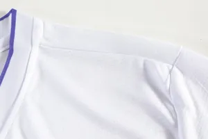 Macro view of white breathable mesh fabric on badminton jersey with purple collar trim