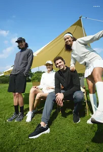 Group of people wearing stand-collar sports jackets during an outdoor camping trip