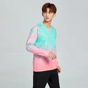 Gradient teal and pink soccer goalkeeper jersey with hexagonal chest padding for training