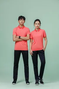 Breathable quick-dry coral sports polo shirts worn by male and female models in a studio