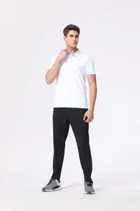 Full body shot of a male model wearing a white quick-dry breathable polo shirt and black trousers
