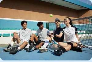 Group of active youths wearing quick-dry tennis polo shirts on an outdoor court.