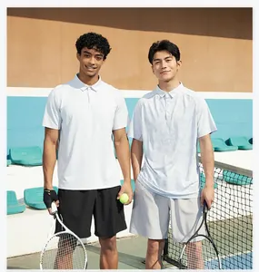 Models wearing quick-dry athletic running shorts and polo shirts on a sunny tennis court
