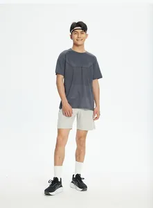 Male model wearing grey quick-dry breathable athletic shorts for running and fitness