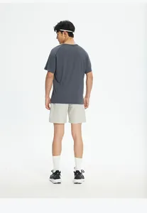 Back view of male model wearing grey quick-dry breathable athletic t-shirt and running shorts