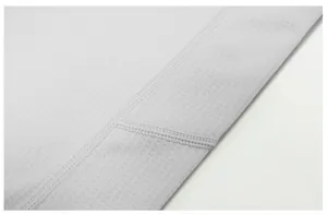 Macro detail of quick-drying breathable mesh fabric and flatlock stitching on sports t-shirt