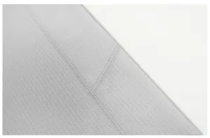 Macro detail of quick-dry sports fabric showing breathable mesh and durable seams.