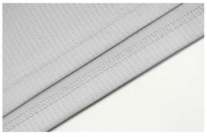 Close-up detail of grey quick-dry sports t-shirt hem with fine double stitching