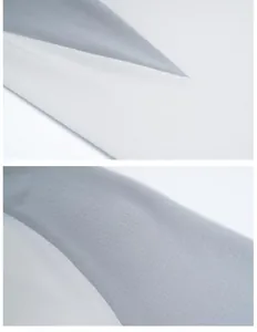 Detailed macro view of quick-dry sports t-shirt fabric texture in grey and white colorway
