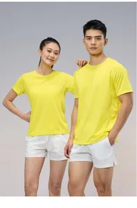Detailed view of yellow quick-dry sports t-shirts on male and female models