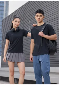 Athletic couple wearing black quick-dry t-shirts for marathon and fitness training outdoor