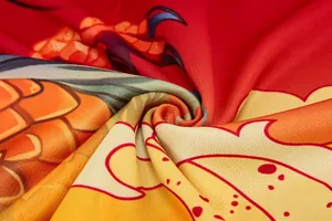 Macro view of quick-dry fabric showing vibrant dragon boat pattern and texture