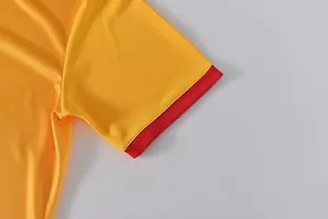 Close-up detail of yellow and red breathable quick-dry dragon boat jersey sleeve