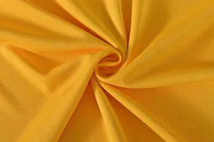 Macro view of yellow quick-dry breathable mesh fabric for athletic dragon boat clothing