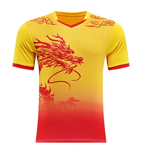 Close-up detail of the vibrant dragon print on a yellow and red gradient racing jersey.