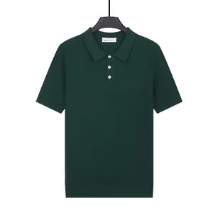 Classic dark green short sleeve knitted polo shirt for men with textured waffle pattern detail