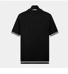 Detailed back view of a black vertical striped knitted Polo shirt with white contrast trim