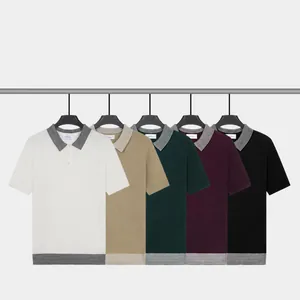 Classic men's short sleeve knit polo shirt with contrast collar available in five colors